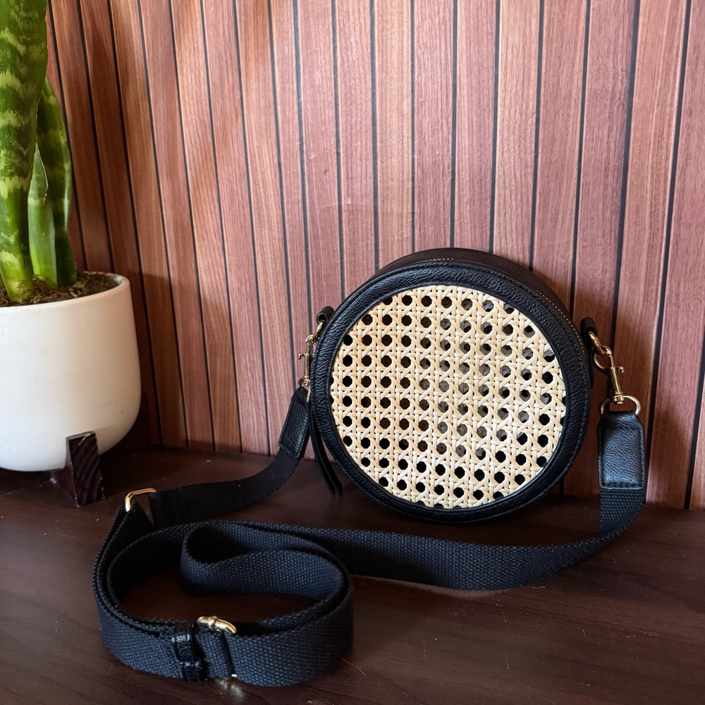 Round rattan black and tan crossbody bag